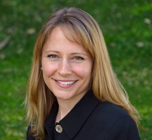 contemporary headshot of a professional woman outdoors