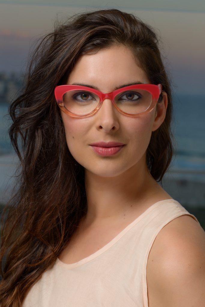 Advertising photo of female model wearing glasses