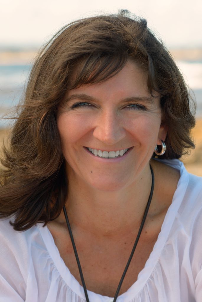 relaxed headshot of a woman at the beach